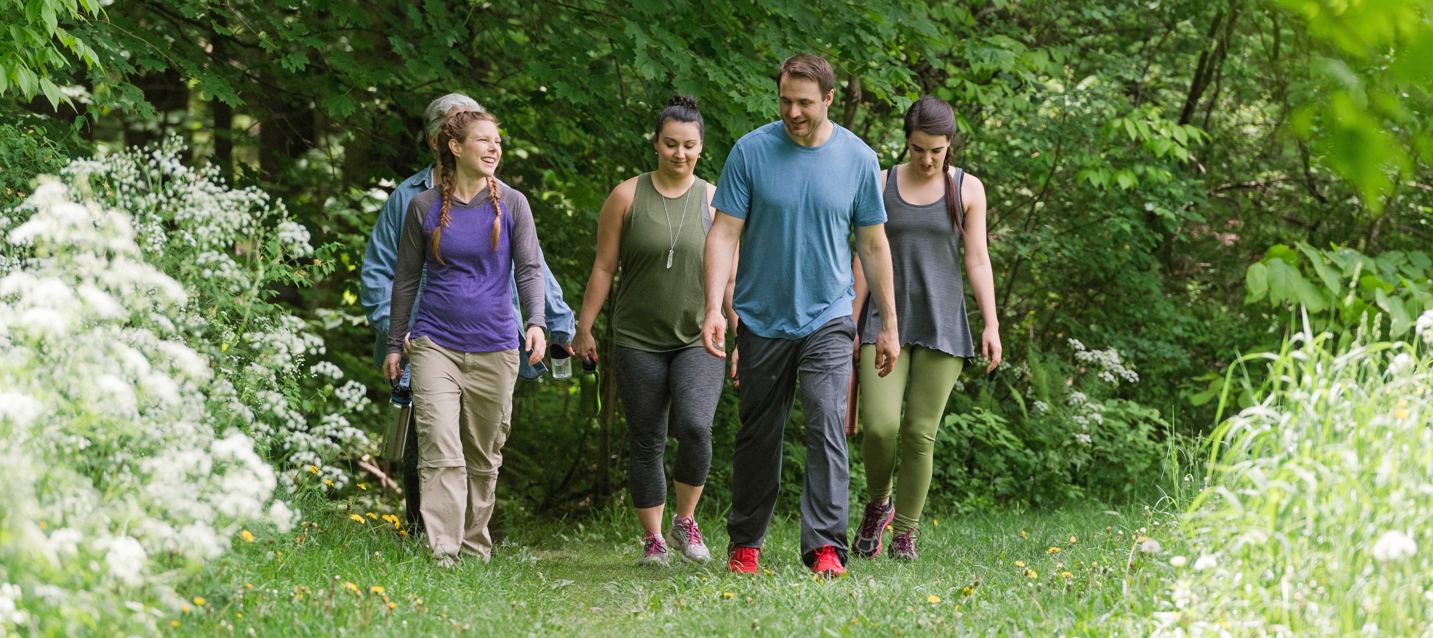 Group of people hiking outdoors in the spring